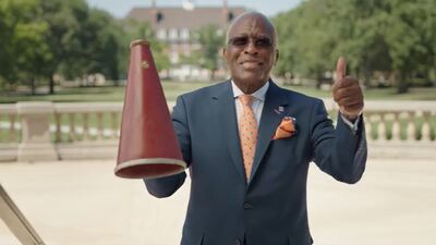 Chancellor Jones gives a ''thumbs up' to students showing their Illini spirit
