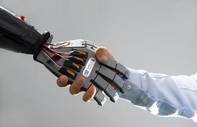 human hand shakes robotic hand. photo credit Ravinder Dahiya