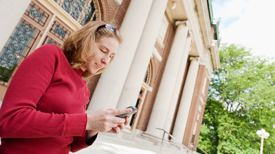 image of woman using a cell phone by L. Brian Stauffer