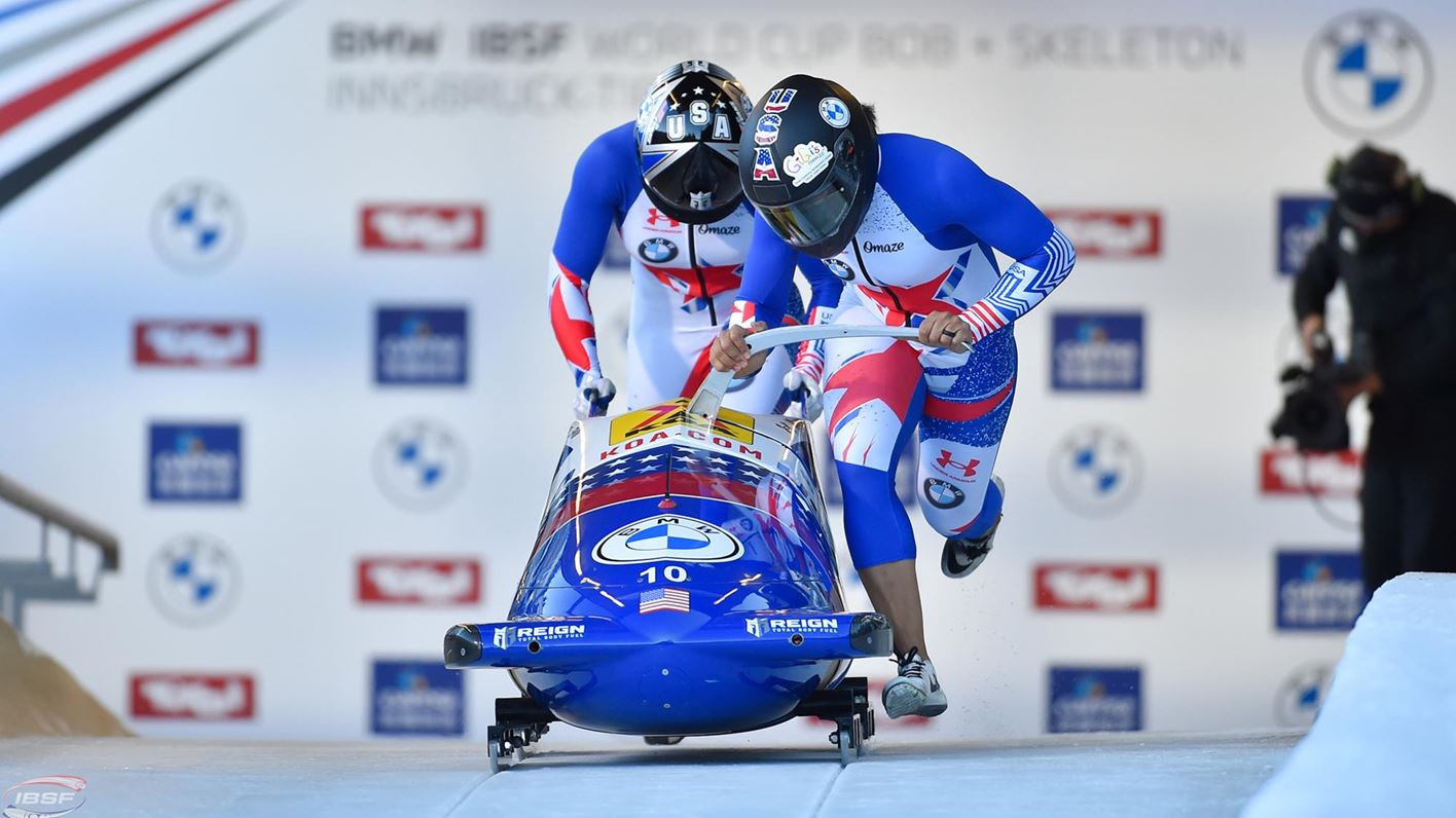 USA bobsledders in their initial push at the starting gate