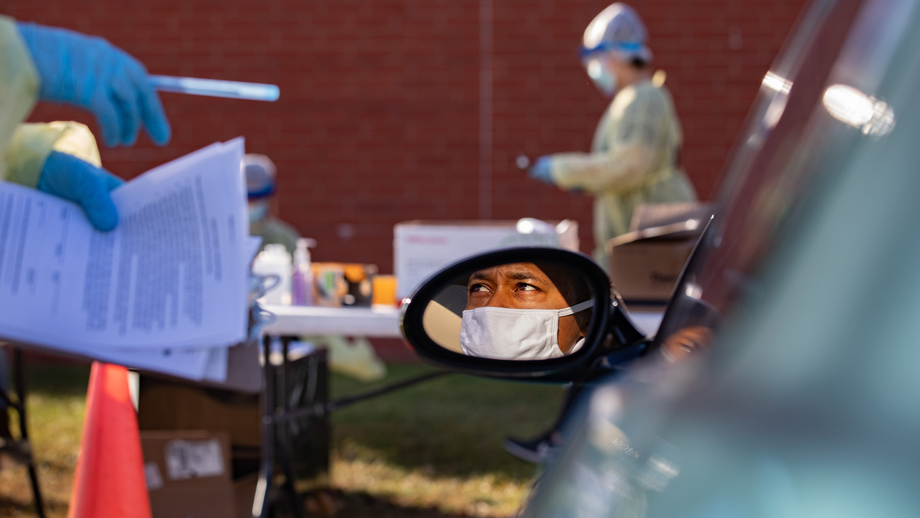 A patient listens to instructions from a worker at a pop-up COVID-19 test site conducted at the Rantoul Parks and Recreation Department.  Photo by Fred Zwicky