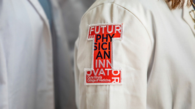 block I arm patch on a physician's jacket says 'future physician-innovator'