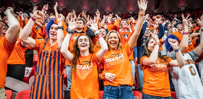 Members of the Orange Krush cheer at a basketball game pre-COVID