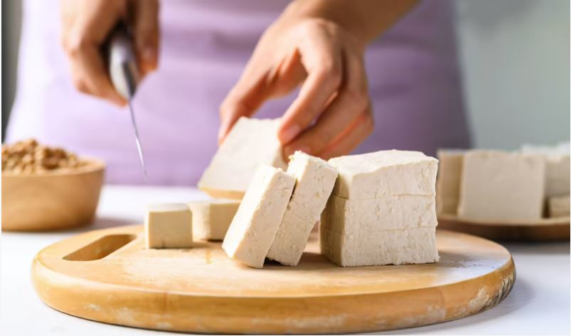Adobe stock image of soy curd being sliced