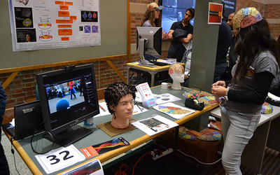 student experiences an exhibit on brain research at Engineering Open House