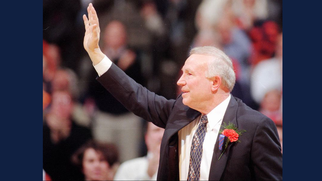 Illinois coach Lou Henson acknowledges a packed Assembly Hall during a ceremony following Henson's final regular-season home game on March 9, 1996. Henson coached the Illini for 21 seasons. (JOHN DIXON / AP)