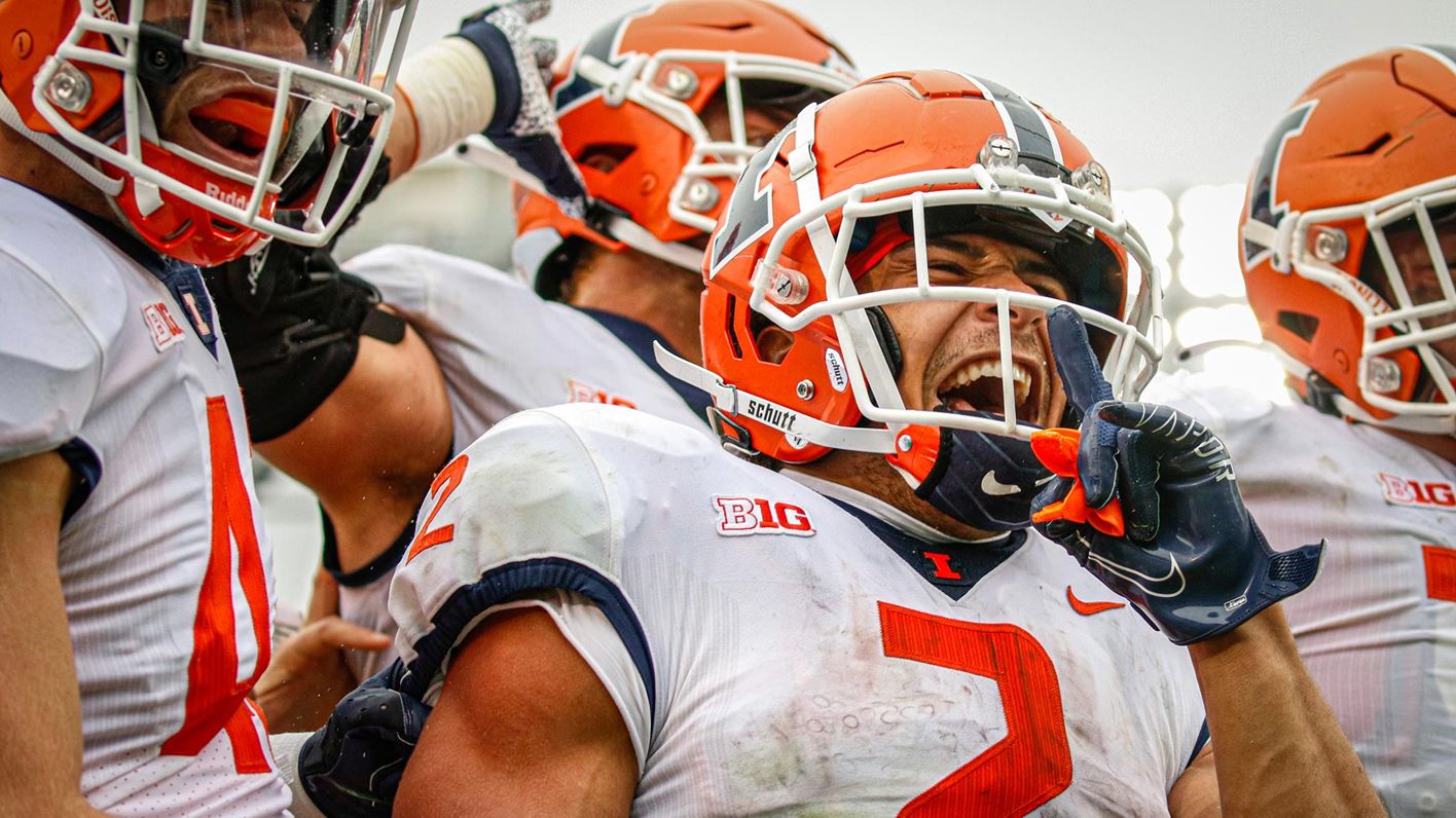 close-up photo of joyous Illini players on the sidelines of Saturday's game agains Penn State