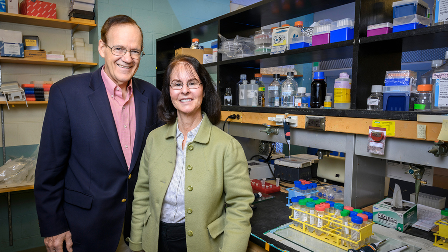 John Katzenellenbogen and Benita Katzenellenbogen in a lab
