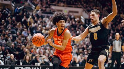 Andre Curbelo drives toward the basket against a Purdue defender