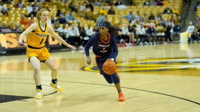 Junior guard Genisis Bryant moves the ball into the front court against a Missouri defender