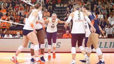volleyball team celebrating something good that happened on the court at Huff Hall on Saturday, September 30, 2023