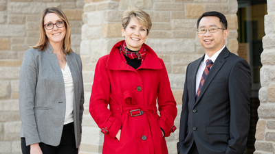 Social work professor Kevin Tan with from left: director of instruction Nicole Rummel and superintendent Lindsey Hall, both of Mahomet-Seymour CUSD No. 3. Photo by Fred Zwicky