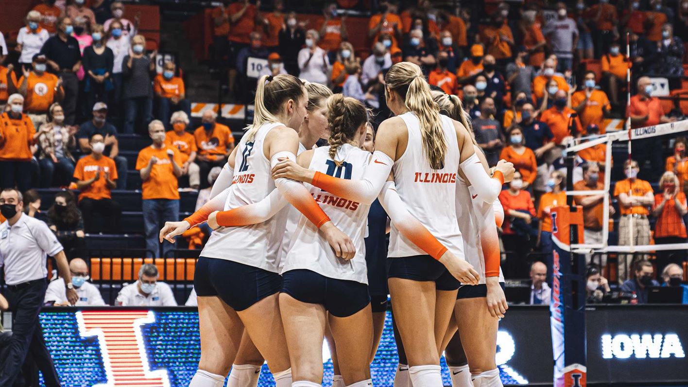 volleyball players in on-court huddle at Huff Hall