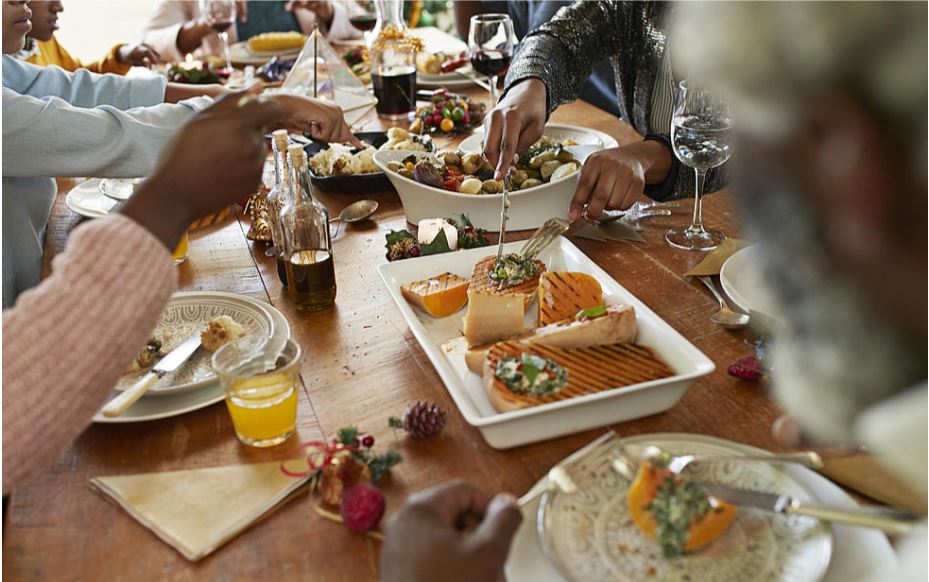 a family dinner features salmon. Getty Images photo