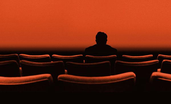 graphic illustration shows silhouette of Ebert in a threatre seat