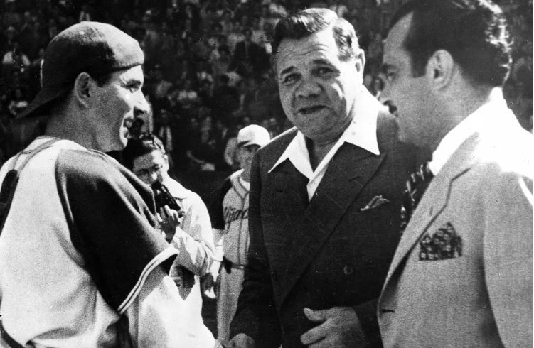 Mexican baseball league president Jorge Pasquel, right, introduces catcher Mickey Owen, left, to Babe Ruth during Ruth’s visit to Mexico in May 1946.(Uncredited / Associated Press)