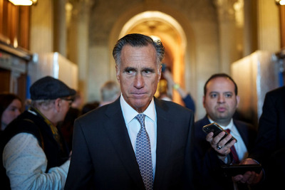 Sen. Mitt Romney (R-Utah) leaves the Senate floor after voting yes on a procedural vote on federal legislation protecting same-sex marriages on Wednesday. (Drew Angerer/Getty Images)