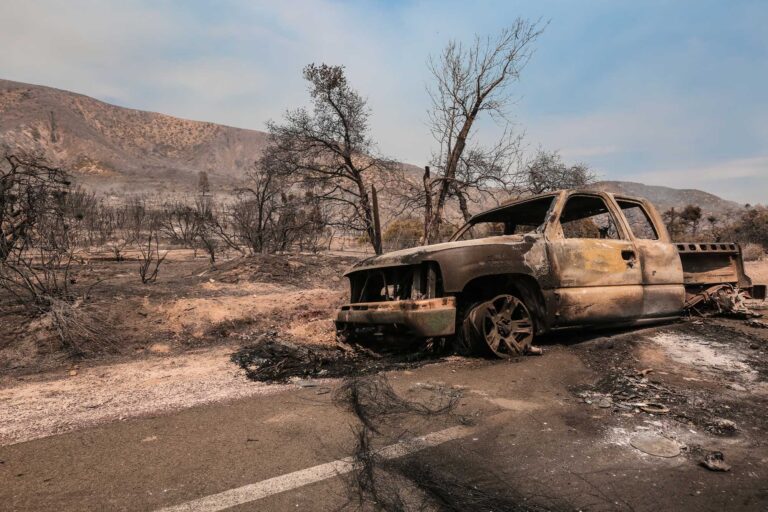 aftermath of wildfire in California shows a burned out Chevy pickeup. Source: Getty Images