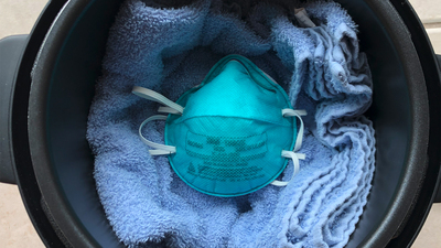 n95 masks on a towel in a rice cooker