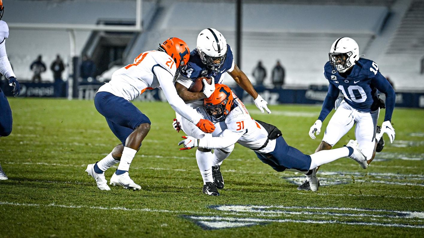 Illini defenders tackle a Penn State running back in a previous game