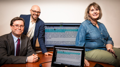 information sciences professor J. Stephen Downie, preservation librarian Kyle Rimkus, and alternate format production specialist Angella Anderson with Disability Resources and Educational Services. Photo by Fred Zwicly