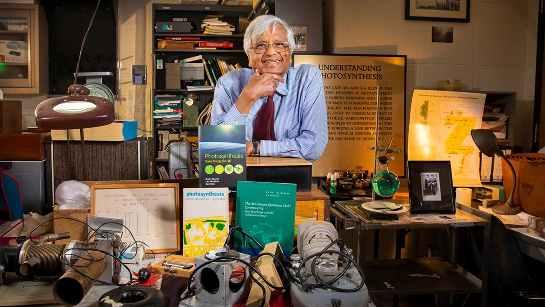 Professor Govindjee in his office, surrounded by memorabilia from decades of studying photosynthesis