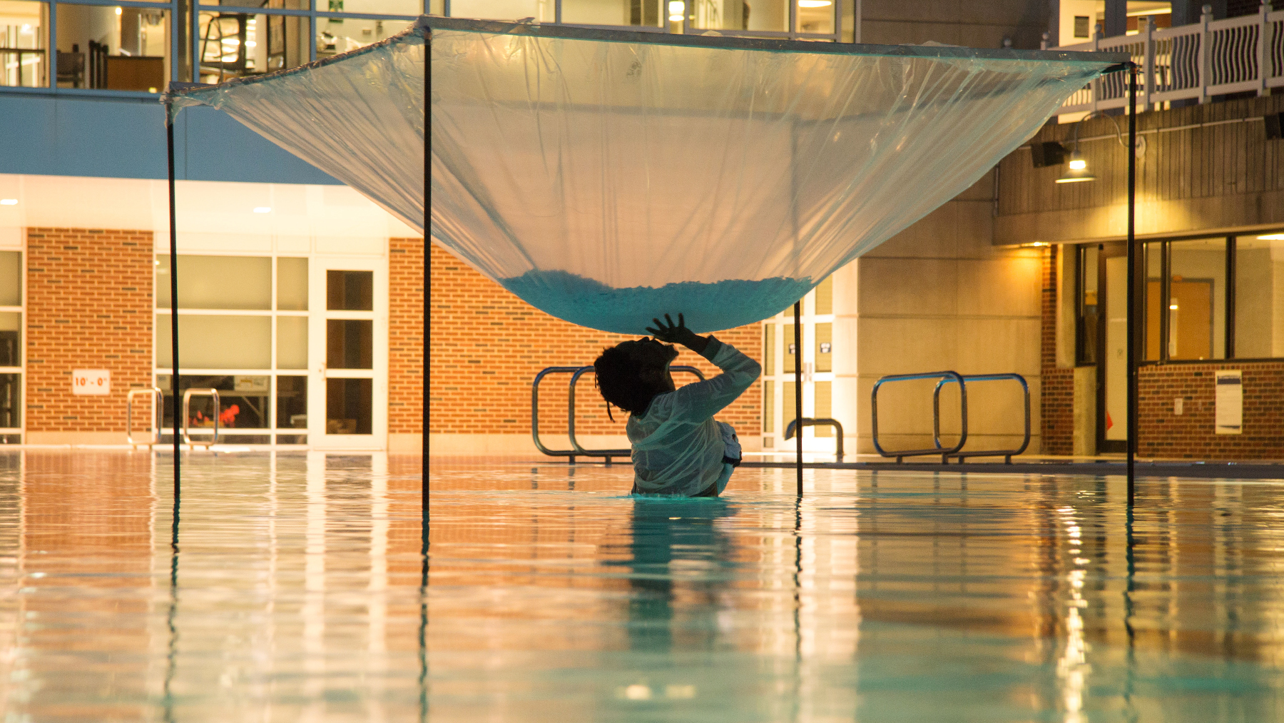 Autumn Knight performing in a U of I outdoor pool. Photo courtesy of KAM