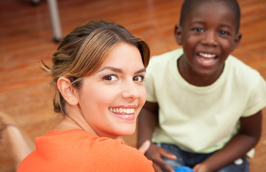 Stock photo of young teacher with early childhood student.
