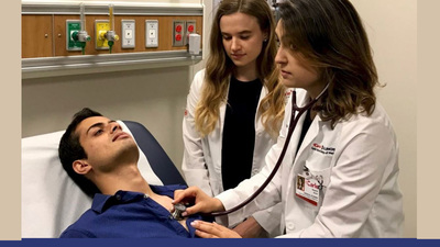 Carle Illinois students practice their clinical skills on a volunteer patient
