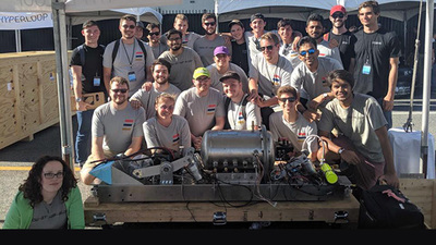 hyperloop team poses with a preliminary design