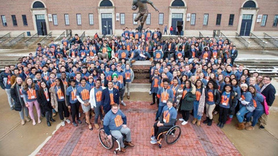 Recreation, Sport and Tourism students gather Close to 350 students gather near the Red Grange statue at Memorial Stadium.