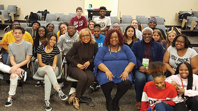 Rita Coburn Whack, shown with students, screened her film about Maya Angelou and discussed it with Urbana High School students. (Photo courtesy of the Alliance for Inclusion and Respect.)