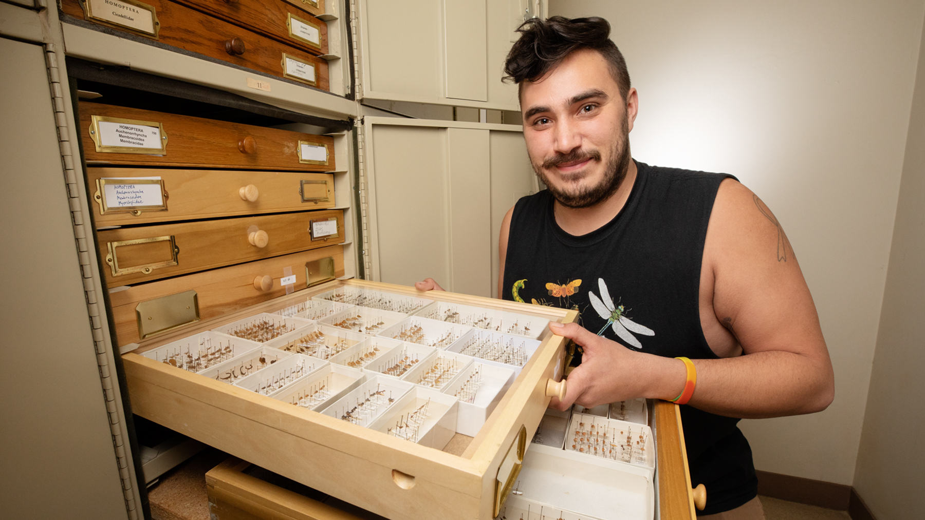Grad student Brendan Morris shows a display of treehoppers