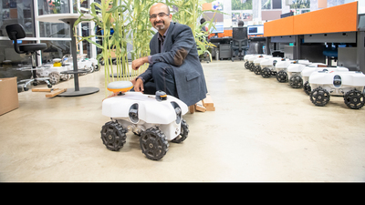 Professor Girish Chowdhary with the TerraSentia robot.