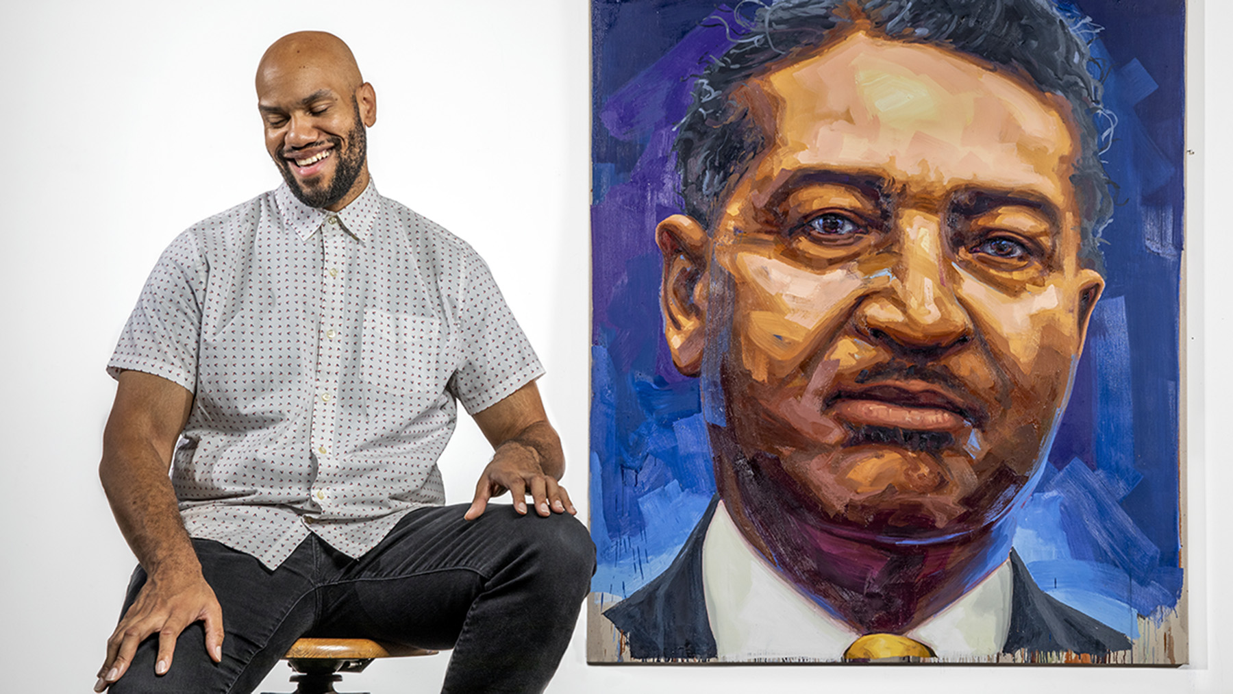 Artist Patrick Earl Hammie, a professor in the School of Art and Design, beside his painted portrait of Albert R. Lee, a pioneer for African American students on campus in the first half of the 20th century. Photo by Fred Zwicky