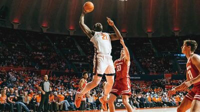Illinois junior Kofi Cockburn goes up with the ball under the basket against a Wisconsin defender