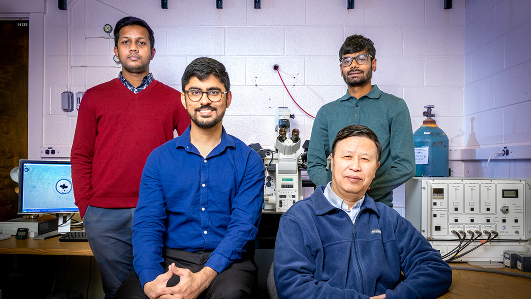 Professor Ning Wang, front right, is joined by researchers, from left, Fazlur Rashid, Kshitij Amar and Parth Bhala.      Photo by Fred Zwicky