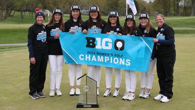 Illini team holds banner reading B1G 2023 Women's Golf Champions