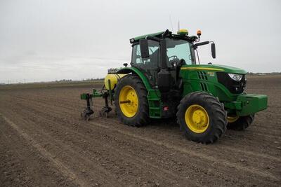 a tractor is used to add nitrogen to a field. Photo courtesy Emerson Nafziger