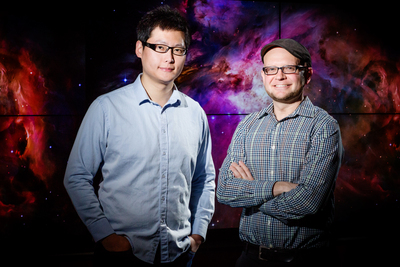 MEteor, an interactive computer simulation, teaches middle school students about gravity and planetary motion in an immersive, whole-body environment. From left, doctoral student Shuai Wang and Robb Lindgren, a professor of educational psychology and of curriculum and instruction, found in a recent study that the astronomy games whole-body learning activities were linked with significant learning gains, greater student engagement and more positive attitudes toward science.
