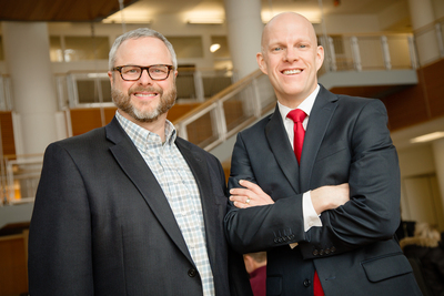 Photo of business professors Jessen L. Hobson, right, and Mark Peecher.