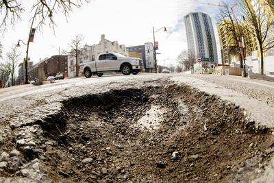 Potholes, like this one on the campus of University of Illinois at Urbana-Champaign, are a common obstacle this winter.