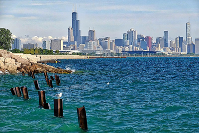 A photo of the Chicago skyline, looking north with Lake Michigan in the foreground