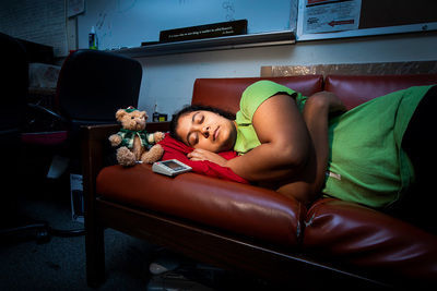 Sleep-deprived for science: Graduate student Ananya Sen rests briefly on the office couch.