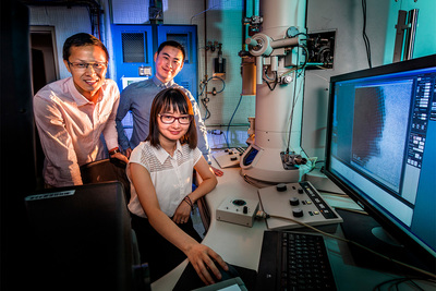 Professor Qian Chen, seated, and graduate students Binbin Luo, left, and Zihao Ou collaborated with researchers at Northwestern University to observe and simulate the formation of crystalline materials at a much higher resolution than before.