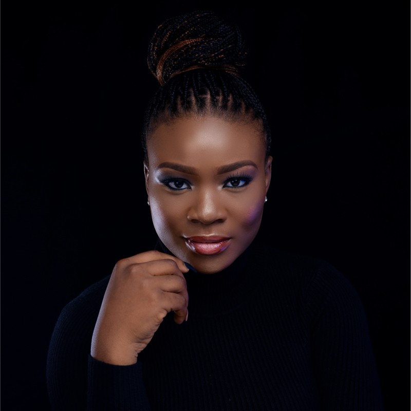 Toyosi Tejumade-Morgan, photographed against a black background.