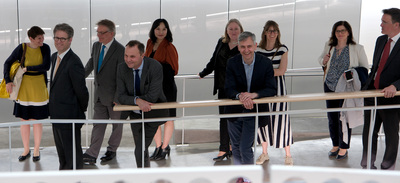 Members in the University of Birmingham delegation laugh with each other during a tour of the Siebel Center on May 15.