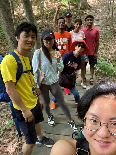 Bree Singleton, an international student advisor specialist for International Education, takes a selfie featuring the International Education Director Yun Shi, third from the left, and several students during a July 29 trip to Clinton Lake State Recreation Area.