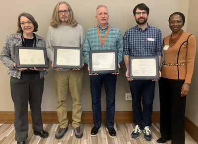 Four Illinois International colleagues, pictured here with Dr. Reitumetse Obakeng Mabokela, the vice provost for International Affairs and Global Strategies, received service awards recognizing how many years they served at the University of Illinois Urbana-Champaign.