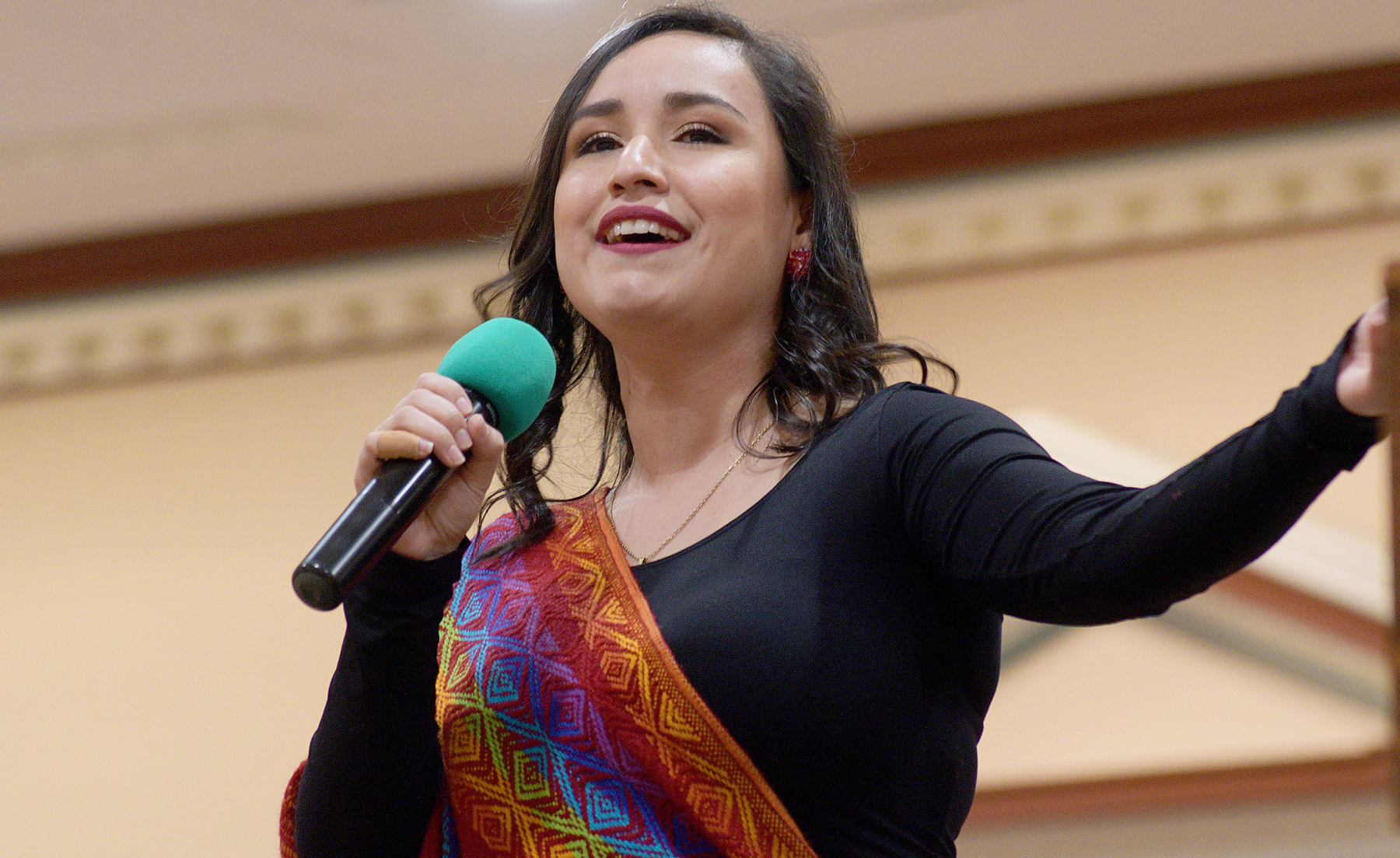 Claudia Espinoza, a graduate student studying music voice performance, sings inside the Illini Union during Travel Around the World on Oct. 17.